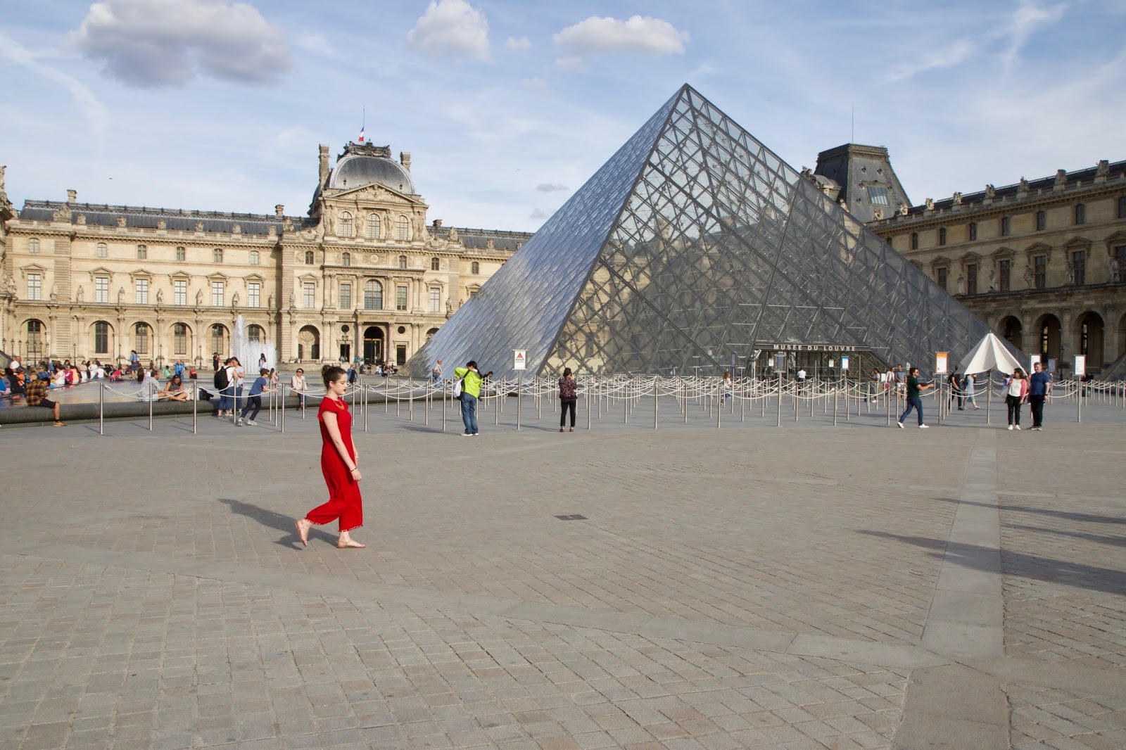 Fashion blogger Kathleen Harper outside the Louvre in Paris France
