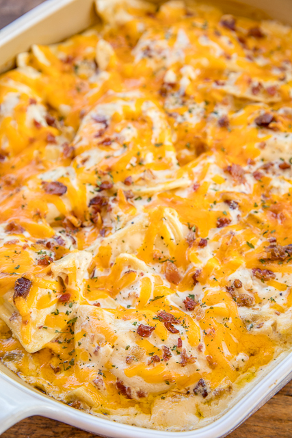 Crack Chicken Pierogi Casserole - CRAZY good!! Frozen pierogies tossed in alfredo sauce, ranch dressing mix, bacon, cheddar and chicken. Can make ahead and refrigerate or freeze for later. Everybody cleaned their plate and asked for seconds!! Weeknight dinner success!! #casserole #chicken #chickencasserole #bacon Crack Chicken Pierogi Casserole - CRAZY good!! Frozen pierogies tossed in alfredo sauce, ranch dressing mix, bacon, cheddar and chicken. Can make ahead and refrigerate or freeze for later. Everybody cleaned their plate and asked for seconds!! Weeknight dinner success!! #casserole #chicken #chickencasserole #bacon