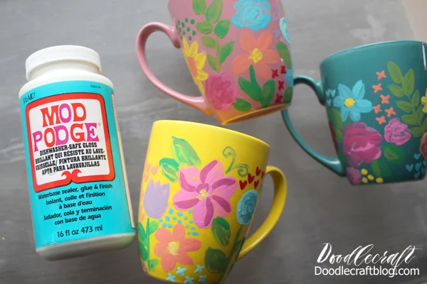 Once the mugs are painted with stunning florals, coat the mugs with Dishwasher Safe Mod Podge.   Let it dry completely and coat one more time.