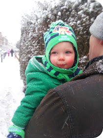 first walk in the snow, toddler in the snow