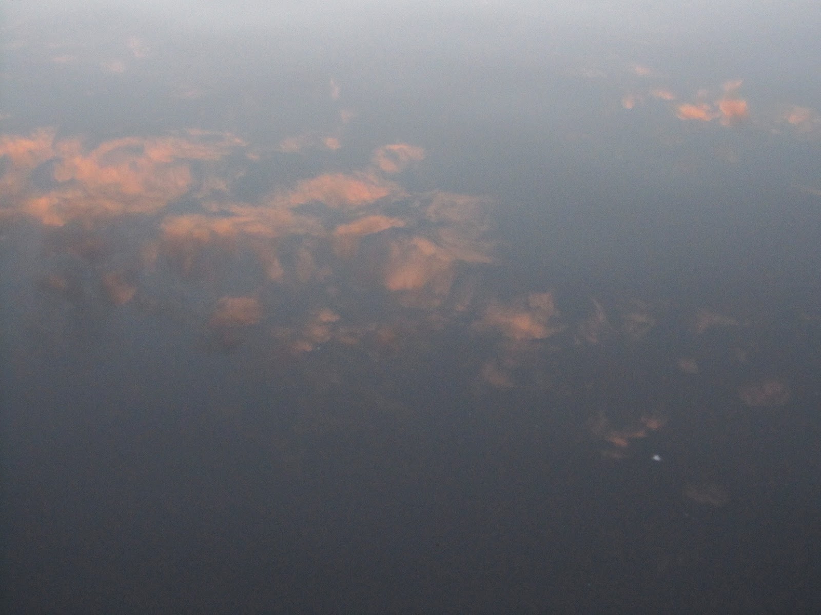 reflection of pink clouds in water