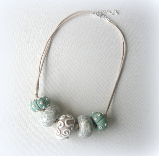 Polymer clay oblate necklace with urchin tones Polymer clay oblate necklace with urchin tones