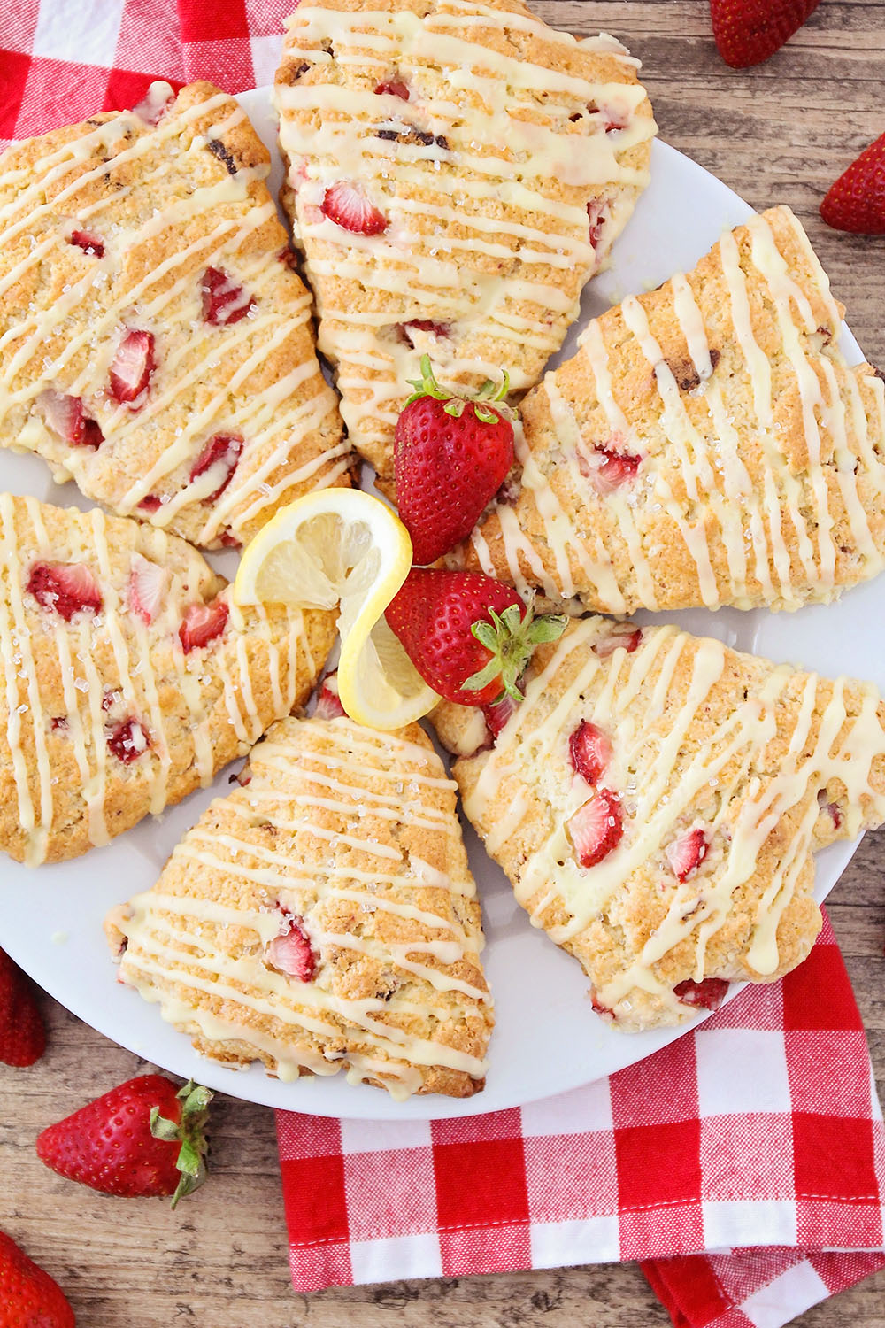 These strawberry lemonade scones taste just like your favorite summertime treat! Delicious strawberry and lemon flavor packed into light and tender scones. 