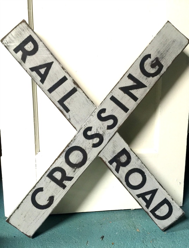 How to make a DIY railroad crossing sign using the wood from an old picnic table. Homeroad.net