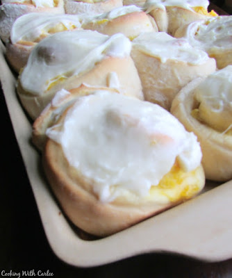 These beauties are the perfect spring and summer treat. Bring the taste of the tropics to your breakfast or brunch table with a pineapple sweet roll! tray of pineapple breakfast rolls with vanilla frosting