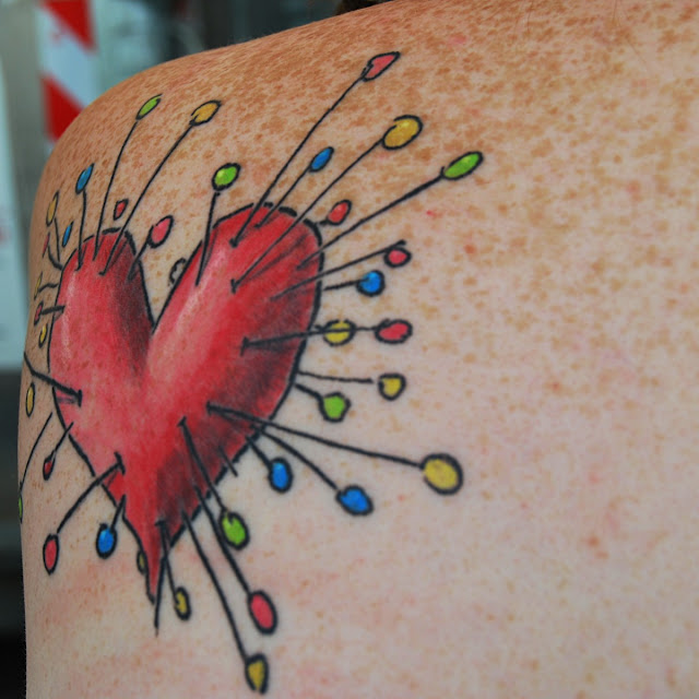 Voodoo Girl heart tattoo on shoulder