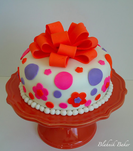 Cute fondant decorated cake - Fondant is a tasteless, thick paste, made of sugar and water. It can be colored and flavored, so it is often used for decorating cakes.