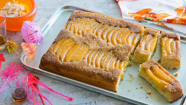 Upside-down mango and coconut cake in a baking tray