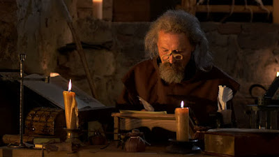 medieval monk with quill pen