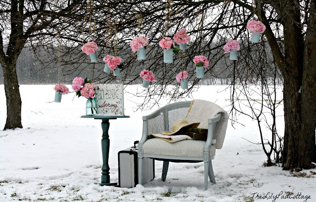 A park bench covered in snow