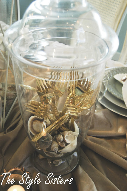 gold forks in apothecary jar