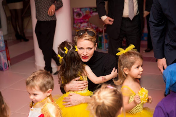 Prince Albert and princess Charlene of Monaco presented gifts to old people and children at "Red Cross" Monaco branch