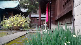 The grounds of Suwadai Shrine. The banner advertises the position of the souvenir stamp table.
