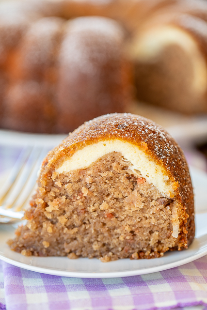 Cream Cheese Carrot Bundt Cake - only a few simple ingredients make this delicious cake. Cake with a can of frosting in the batter. Carrot cake mix, water, oil, eggs, a can of coconut pecan frosting, cream cheese and sugar. I couldn't believe how delicious this cake tasted. Can make a few days in advance and store in an air-tight container. Great for holidays and potlucks! #cake #carrotcake #dessert Cream Cheese Carrot Bundt Cake - only a few simple ingredients make this delicious cake. Cake with a can of frosting in the batter. Carrot cake mix, water, oil, eggs, a can of coconut pecan frosting, cream cheese and sugar. I couldn't believe how delicious this cake tasted. Can make a few days in advance and store in an air-tight container. Great for holidays and potlucks! #cake #carrotcake #dessert