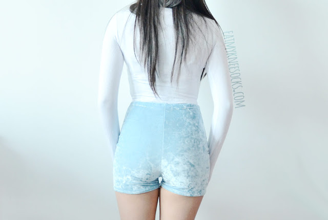 Hand Cooked Karma Fashion Review: Crushed Velvet Lace-Up Shorts A cute outfit featuring the lace-up crushed velvet corset-style high-waisted pastel blue shorts from Home Cooked Karma (Etsy), worn with a semi-sheer white long sleeve crop top.