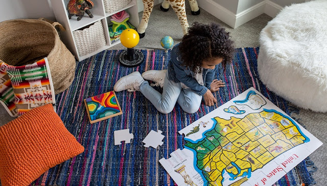 Image: Child doing Puzzle, by Lonely Planet on Unsplash