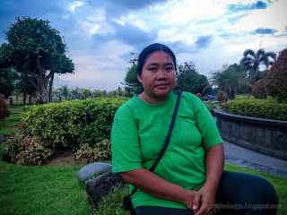 Beautiful Woman Enjoy A Holiday In The Wide Garden In The Afternoon At Badung, Bali, Indonesia