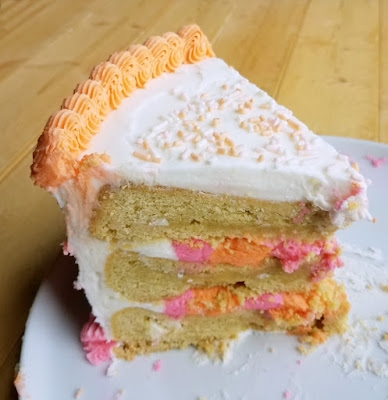 Special occasion cookies just went to the next level! Layers of cookie and plenty of frosting, making it perfect for a celebration! large slice of layered cookie birthday cake