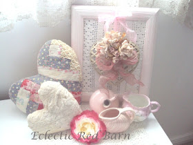 Vintage quilted hearts, framed metal heart, small pink pitchers,and varigated rose