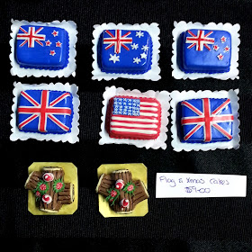 One-twelfth scale dolls house cakes decorated with flags of Australia, New Zealand, Britain or The United States.