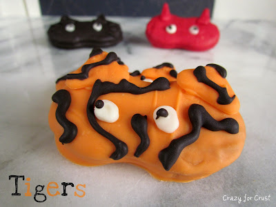 nutter butter cookies decorated to look like tiger halloween masks