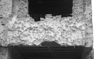 the plaster torn by bullets in Mostar