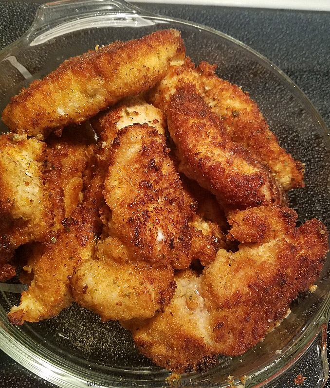 these are baked chicken tenders in a glass baking dish