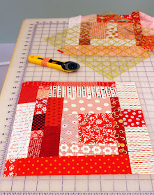 Wonky Log Cabin blocks all in red - link to tutorial to make the blocks