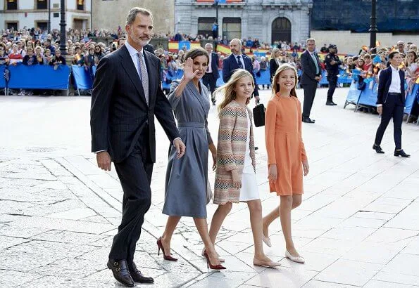 Queen Letizia wore grey coat dress, Crown Princess Leonor wore a Mango pattern jacket and Infanta Sofía wore a coral Mango dress
