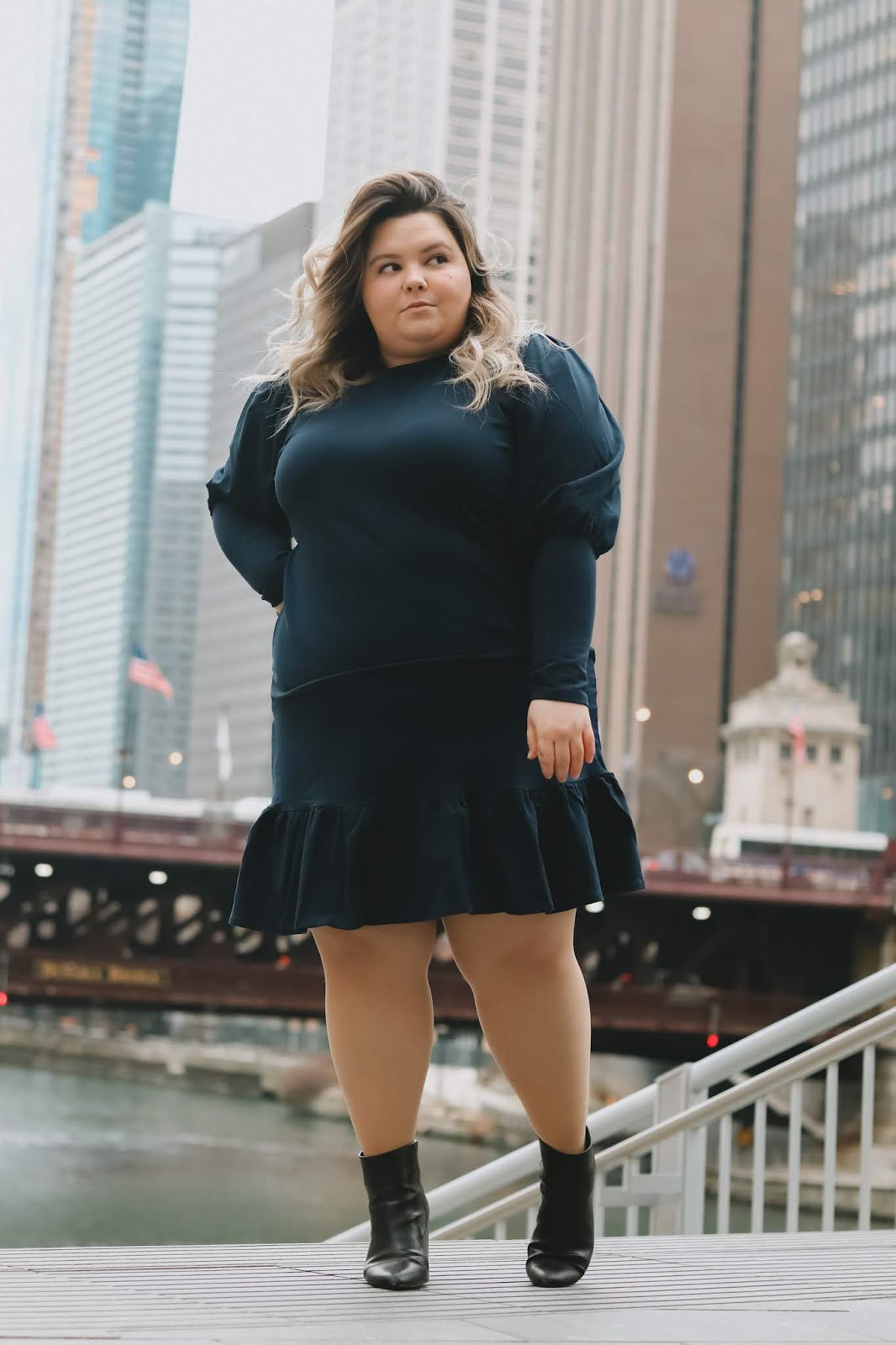 Chicago Plus Size Petite Fashion Blogger Natalie in the City reviews Eloquii's Flounce Hem Sweatshirt Dress.
