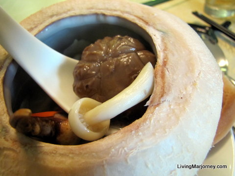 Double Boiled Crab Claw Soup with Superior Mushroom in Fresh Coconut