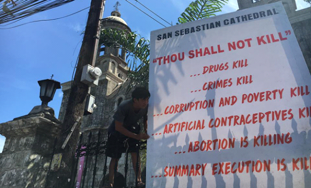 Banners against killings on display at Bacolod Cathedral