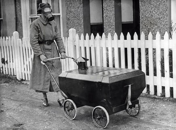 40 Must-See Photos Of The Past - Woman With A Gas-Resistant Pram, England, 1938