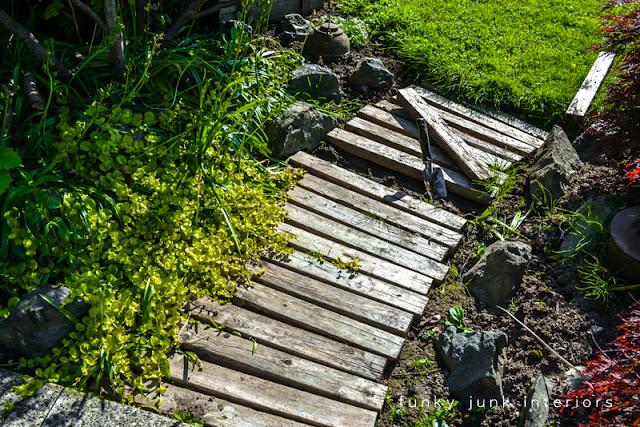How to weed and upkeep a pallet wood walkway garden path.