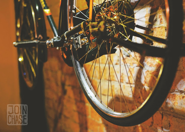 A bicycle hanging on a wall inside Fahrenheit Cafe and Bar in Yangon, Myanmar.