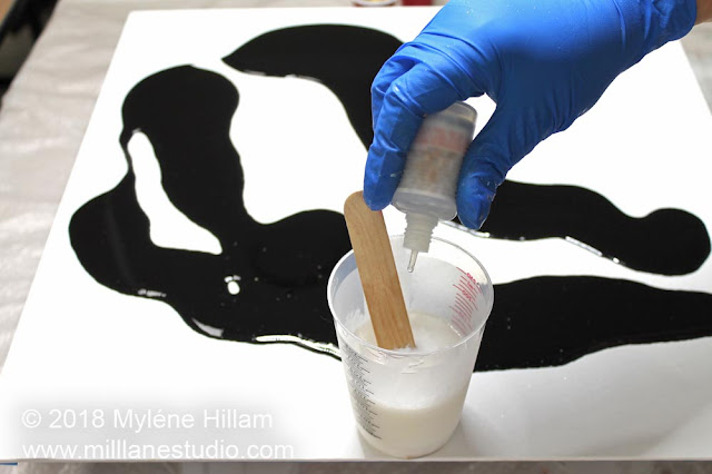 Dropping the silicone oil into the white resin