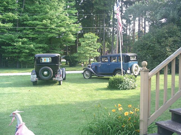 With two great American cars. My 1930 Chevy and a '31 Ford Model A ~