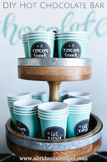 A DIY Hot Chocolate Bar would be PERFECT for your winter wedding. Find out how to make one at www.abrideonabudget.com.