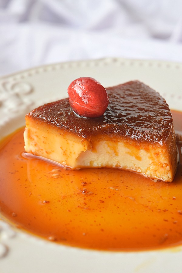 white plate served with crème caramel,caramel pudding,Flan