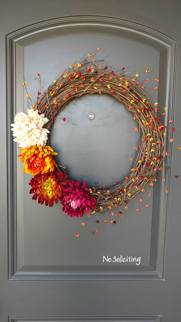 Wreaths are an easy way to add a little decor for any season.  This fall flowers and berries wreath can be made for less than 1/2 the price of a store bought one in about 30 minutes!