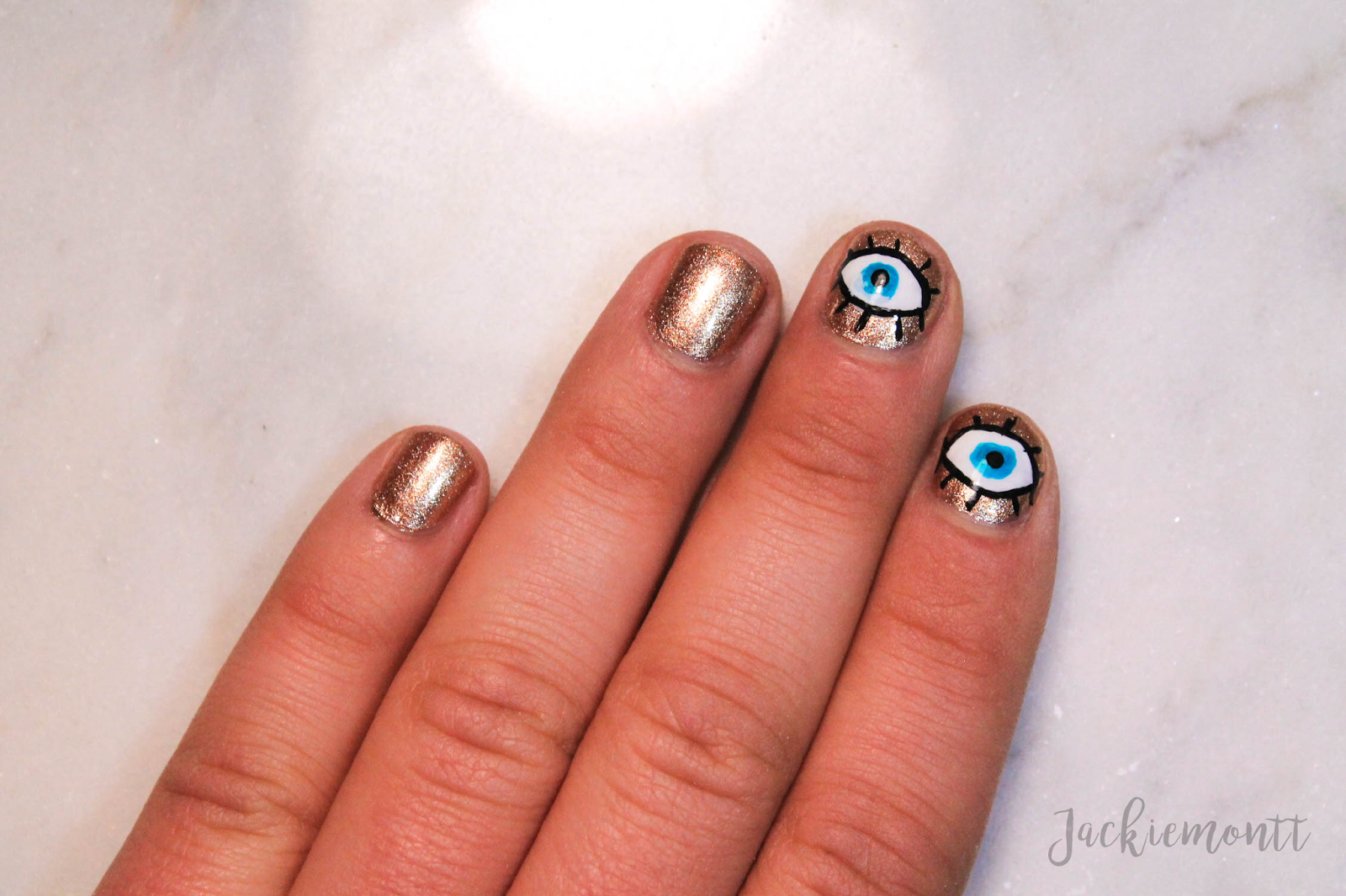 4. "Evil Eye Nail Design Ideas for a Bold and Unique Look" - wide 1