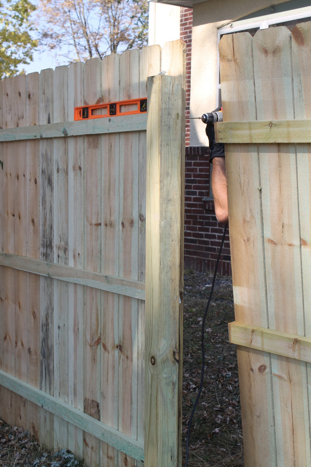 Hammers and High Heels Fence Panels Up. Concrete Slab Down. Just A Bit