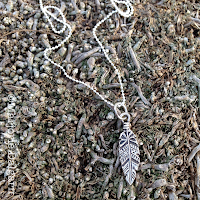 fine silver feather pendant by Emeline Purcell