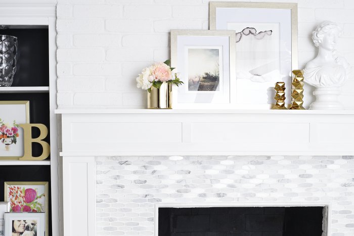 This is a DIY before and after fireplace makeover that is a must see. The post features tons of photos of the new marble fireplace surround, and the blogger custom built the mantelshelf using inexpensive wood and MDF. There's a link to a detailed tutorial on how she did it. (via monicawantsit.com)