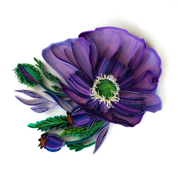 on-edge, quilled purple and green paper flower with fringed center