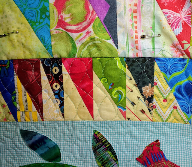 Free motion loops quilted on a narrow border