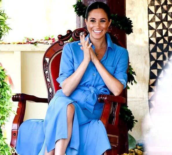 Prince Harry posted a new picture of his wife. Meghan Markle wore Veronica Beard sky blue cara dress
