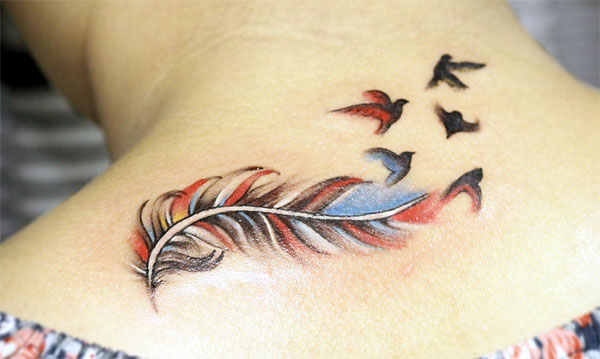 This is a delicate and beautiful feather tattoo with flying birds nice colorful ink tattoo designs This is a delicate and beautiful feather tattoo with flying birds nice colorful ink tattoo designs