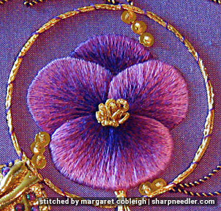 Thread painted purple pansy in centre of goldwork design. (Royal School of Needlework, goldwork with pansy)