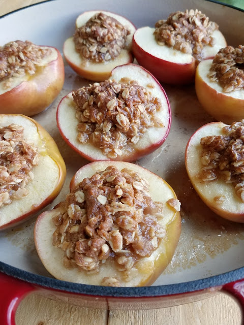 Are they a baked apple or apple crisp? These fun desserts are a little bit of both. Tasty baked apples topped with crunchy brown sugar and oat topping. They are perfect individually sized treats that might just become your favorite fall dessert. apple crisp baked apples fresh from the oven with golden brown sugar and oatmealfilling